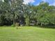 House nestled in a wooded area with spacious yard at 15222 Lost Lake Ln, Lithia, FL 33547