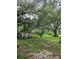 Large backyard with shed and mature trees at 15222 Lost Lake Ln, Lithia, FL 33547