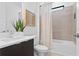 Clean bathroom with a tub, toilet, and modern vanity at 2402 N Boulevard, Tampa, FL 33602