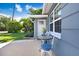 Inviting front yard with a small table and chairs near the front entrance at 6154 Delaware Ave, New Port Richey, FL 34653