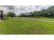 Landscaped backyard with a view of a golf course at 25954 Risen Star Dr, Wesley Chapel, FL 33544