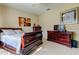 Spacious bedroom with a sleigh bed and ample storage at 25954 Risen Star Dr, Wesley Chapel, FL 33544