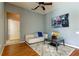 Living room with hardwood floors, comfy couch and large picture at 25954 Risen Star Dr, Wesley Chapel, FL 33544