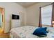 Bright bedroom with a comfortable bed and plenty of closet space at 25954 Risen Star Dr, Wesley Chapel, FL 33544