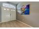Bright and spacious entryway with tile floors and a large painting at 25954 Risen Star Dr, Wesley Chapel, FL 33544