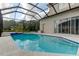 Screened pool with plenty of space for relaxation at 25954 Risen Star Dr, Wesley Chapel, FL 33544