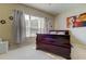 Relaxing bedroom with a sleigh bed, large window, and soft lighting at 25954 Risen Star Dr, Wesley Chapel, FL 33544