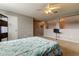 Spacious bedroom with ceiling fan and en-suite access at 25954 Risen Star Dr, Wesley Chapel, FL 33544
