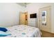 Well-lit bedroom with a comfortable bed and built-in wardrobe at 25954 Risen Star Dr, Wesley Chapel, FL 33544