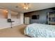 Bright bedroom with dark accent wall and built-in shelving at 25954 Risen Star Dr, Wesley Chapel, FL 33544