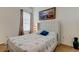 Relaxing bedroom with a double bed, nightstand, and wall art at 25954 Risen Star Dr, Wesley Chapel, FL 33544