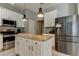 Kitchen with granite island and stainless steel appliances at 25954 Risen Star Dr, Wesley Chapel, FL 33544