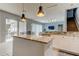 Spacious kitchen with island, granite countertops, and modern lighting at 25954 Risen Star Dr, Wesley Chapel, FL 33544