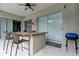 Covered patio with outdoor bar and grill at 25954 Risen Star Dr, Wesley Chapel, FL 33544