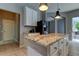 Kitchen with granite countertop island and breakfast bar at 25954 Risen Star Dr, Wesley Chapel, FL 33544