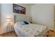 Cozy bedroom featuring a queen-size bed and tasteful decor at 25954 Risen Star Dr, Wesley Chapel, FL 33544