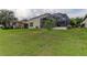Backyard view of single Gathering home with screened patio at 25954 Risen Star Dr, Wesley Chapel, FL 33544