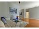 Spacious living room with hardwood floors, featuring a cozy couch at 25954 Risen Star Dr, Wesley Chapel, FL 33544