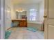 Bathroom features a large garden tub, double vanity, and tiled floor at 25954 Risen Star Dr, Wesley Chapel, FL 33544