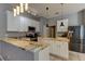 Open concept kitchen with granite countertops and stainless steel appliances at 25954 Risen Star Dr, Wesley Chapel, FL 33544