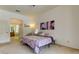 Main bedroom with direct access to bathroom and ceiling fan at 25954 Risen Star Dr, Wesley Chapel, FL 33544
