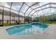 Refreshing pool with screened enclosure at 25954 Risen Star Dr, Wesley Chapel, FL 33544