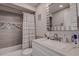 Updated bathroom with a modern vanity and tiled shower/tub combo at 2438 Enterprise Rd # 6, Clearwater, FL 33763