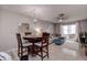 Charming dining area with wood table and four chairs at 2438 Enterprise Rd # 6, Clearwater, FL 33763