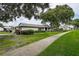 Charming single-story home with well-manicured lawn and walkway at 2438 Enterprise Rd # 6, Clearwater, FL 33763