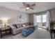 Spacious living room with comfy seating and large windows at 2438 Enterprise Rd # 6, Clearwater, FL 33763