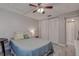 Well-lit bedroom with a queen bed and large closet at 2438 Enterprise Rd # 6, Clearwater, FL 33763