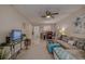 Bright living room featuring a comfy sofa, tile floors, and a dining area at 2438 Enterprise Rd # 6, Clearwater, FL 33763