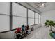 Relaxing sunroom with multiple windows, tile flooring, and potted plants at 2438 Enterprise Rd # 6, Clearwater, FL 33763