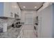 White kitchen with granite countertops and stainless steel appliances at 2438 Enterprise Rd # 6, Clearwater, FL 33763
