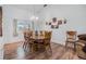 Spacious dining area features a large wood table and six chairs at 13199 Drysdale St, Spring Hill, FL 34609