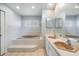 Bathroom with a large soaking tub and double vanity at 13199 Drysdale St, Spring Hill, FL 34609