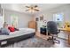 Spacious bedroom with a desk, chair, and ample closet space at 13199 Drysdale St, Spring Hill, FL 34609