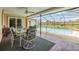 Relaxing pool area with covered patio and seating at 13199 Drysdale St, Spring Hill, FL 34609