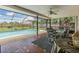 Inviting screened-in pool area with patio furniture at 13199 Drysdale St, Spring Hill, FL 34609