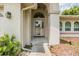 Inviting entryway with a covered porch leading to the front door of the house at 13199 Drysdale St, Spring Hill, FL 34609