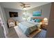 Relaxing bedroom with teal bedding, woven furniture, natural light and modern décor at 3422 29Th E St, Bradenton, FL 34208