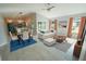Open-concept living and dining area boasts sleek tile floors, neutral paint, and bright, natural light at 3422 29Th E St, Bradenton, FL 34208