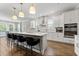 Modern kitchen with white cabinets, large island, and stainless steel appliances at 9848 Wild Begonia Loop, Land O Lakes, FL 34637