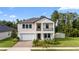 Two story house with balcony and landscaping at 9848 Wild Begonia Loop, Land O Lakes, FL 34637