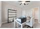 Home office with desk, printer, and access to adjacent bathroom at 9848 Wild Begonia Loop, Land O Lakes, FL 34637