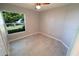 Simple bedroom featuring tile floors and a window at 3422 29Th E St, Bradenton, FL 34208