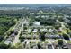 Aerial view of a residential neighborhood with houses and a central lake at 3422 29Th E St, Bradenton, FL 34208