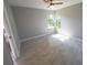 Spacious bedroom with tile floors and a large window at 3422 29Th E St, Bradenton, FL 34208