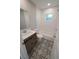 Clean bathroom with a patterned floor and modern vanity at 3422 29Th E St, Bradenton, FL 34208