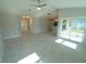 Spacious living area with tile floors, high ceilings, and sliding glass doors at 3422 29Th E St, Bradenton, FL 34208